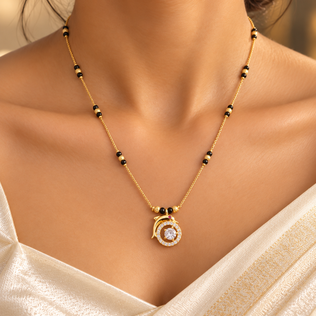 Close-up of Tarini Mangalsutra worn with an ivory saree, showing the circular halo and curved gold flourish