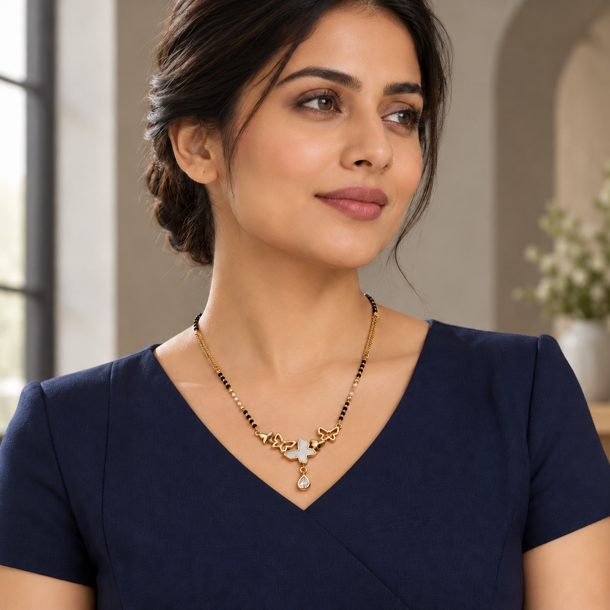Vespera mangalsutra styled with a modest navy professional dress.