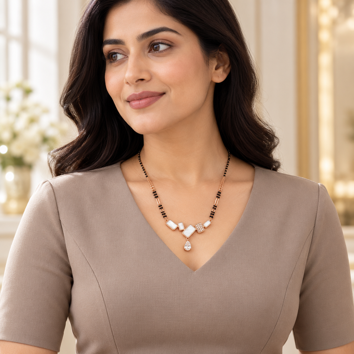 Geometric mangalsutra styled with a complete taupe professional dress